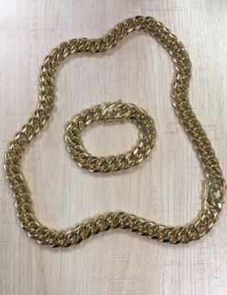 New 14 k yellow gold Cuban link chain and bracelet