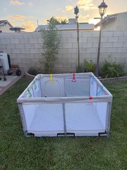 Gray play pen for babies or toddlers