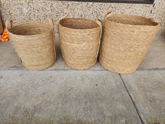 3 woven baskets 19", 17" ,15" high