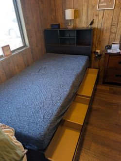 Twin size bed with headboard and two bottom drawers