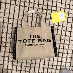 Marc Jacobs The Tote Bag Mini in canvas, color Warm Sand (263), style M0017025.