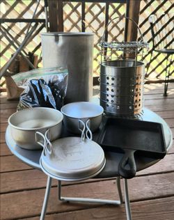DIY Outdoor Small Firepit with  BBQ Grill top and outer Container. Comes with small Supply of Charcoal, a small Cast Iron Pan and a 3 pc. EverNew Camp