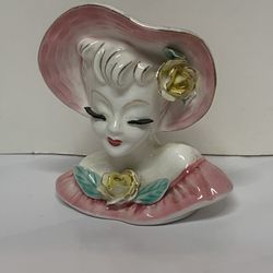  vintage 1950s Napco lady head vase, featuring a pink hat and dress with yellow rose accents. 