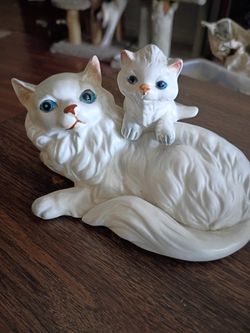 White long hair cat with kitten figurine