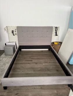 Queen-size bed frame only—without slats or base.