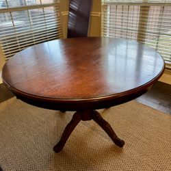 Round Pedestal Extendable Dining Table