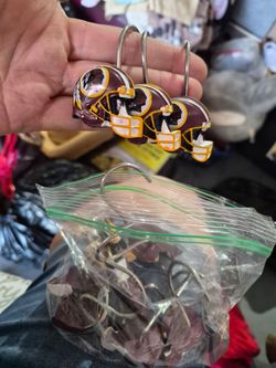Washington red skins helmet, shower books, a dozen of them