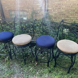 Four Solid Iron Swivel Stools 