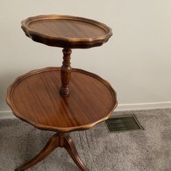 Antique two-tiered "pie crust" table, also known as a dumbwaiter table. 