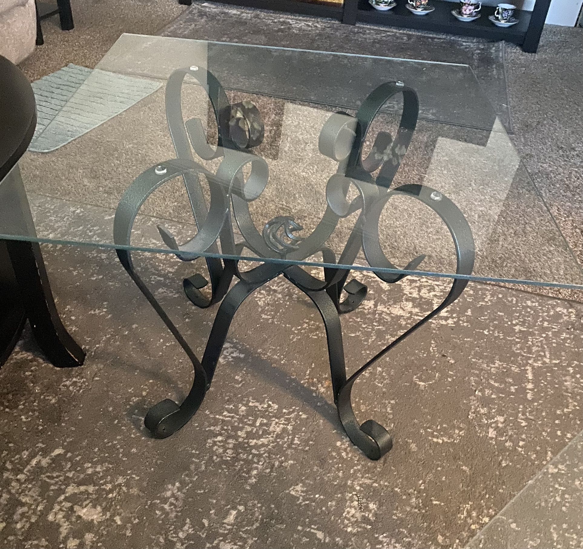 Vintage pair of wrought iron indoor outdoor glass top end tables. Great condition very sturdy.