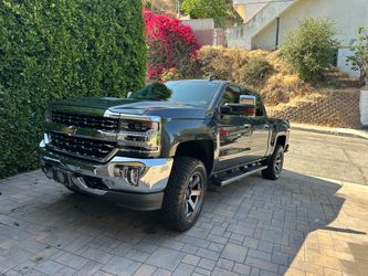 Chevy Silverado 1500 LTZ ,dark green,midsize truck