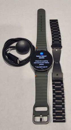 Galaxy watch 7 with charge cord and an extra metal band -- Local exchange only.