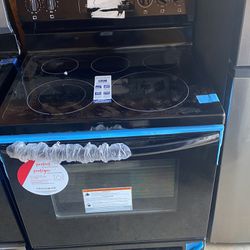 Brand new Frigidaire oven with GE over the counter microwave