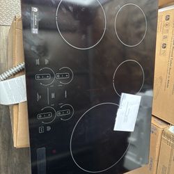 GE Profile 30-in 4 burners Black Smart Compatible Induction Cooktop with Bridge Element