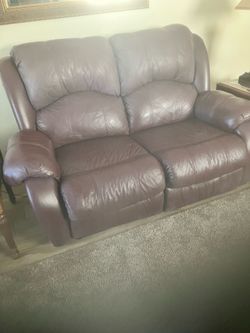 Italian Leather reclining love seat and matching recliner in Burgundy