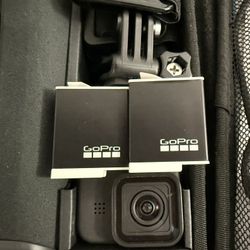 GoPro HERO11 Black Bundle – 2 Batteries, Large Mount Kit, Float Grip, 2 Cases – Excellent Condition