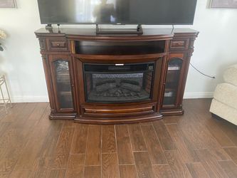 Brown electric  fireplace tv stand