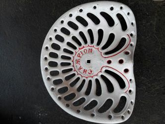 Vintage cast iron tractor seat made by champion has been painted this seat is very rare only one I have ever seen