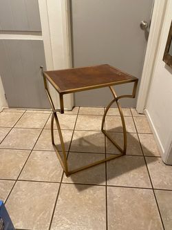 Brass and leather stand