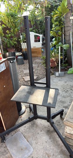 black metal mobile TV cart with locking caster wheels
