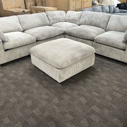 Light Gray Cloud Modular Sectional And Ottoman 
