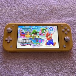 NINTENDO SWITCH LITE with 100 SWITCH GAMES INCLUDED