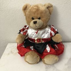 Build A Bear Workshop Teddy Bear Wearing A Really Cute Pirate Dress.  The Dress Is New.  Size 15 Inches Tall.  Preowned excellent condition.  