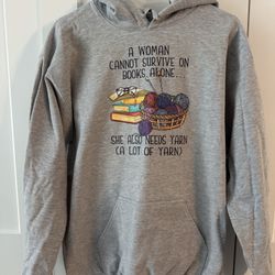 NWOT Unisex Sweatshirt, Size M, “A Woman Cannot Survive On Books Alone…”