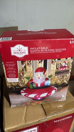 Inflatable Christmas Santa in flying saucer