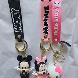 silicone keychains featuring the characters Mickey Mouse, Minnie Mouse, and Hello Kitty. 