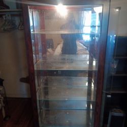 Glass curio cabinet with light 