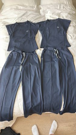 Two pairs of top and bottom FormX FIGS scrubs