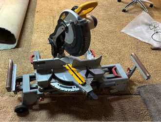 12” DEWALT compound miter saw with MAXTECH rolling stand.