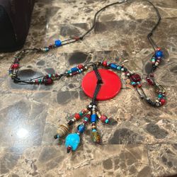 Chicos Black Leather Cord Gold Glass Bead Red Medallion Tassel Necklace