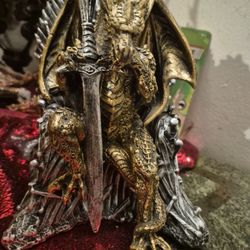 Dragon Sitting On Trone Made Of Swords