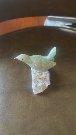 Opal bird with gold legs.