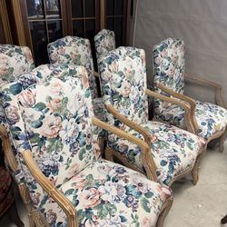 vintage-inspired dining armchairs by Casa Stradivari feature refined faux bois frames and elegant floral upholstery