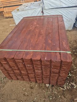 Stained  redwood  fence boards, / pocket