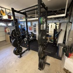 Rogue R-3 squat rack with pull up bar, barbell and concrete anchors