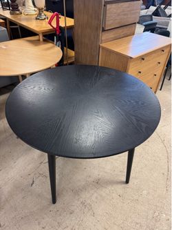 black wood round dining table with tapered legs - 40”