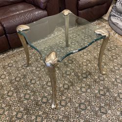 Table in the style of P.E Guerin. Glass top and beautiful brass legs. 