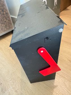 Black Metal Mailbox with Red Flag