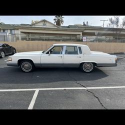 1991 Cadillac Fleetwood brougham  White on tan  