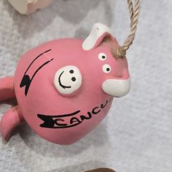 Hand-sculpted, Mexican clay folk art miniature pig ornament/bell
from Cancun.