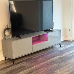 Large Flat Screen TV with Modern TV Stand