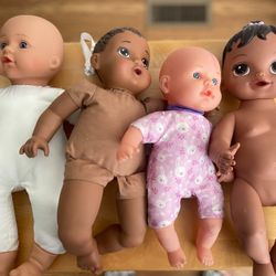 Dolls set of 4, One Doll is Interactive: sneezes, etc. 