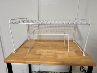 Two white wire shelf risers / cabinet organizers