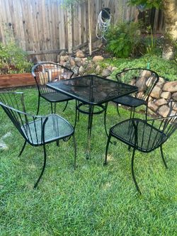 Wrought iron table and 4 chairs