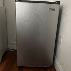 Small Fridge with Includes a mini freezer inside 