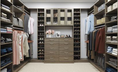 Master Walk-In Wood Grain Color with Glass Doors, Flat Drawer Fronts and Shoe Shelving. Everything is adjustable.